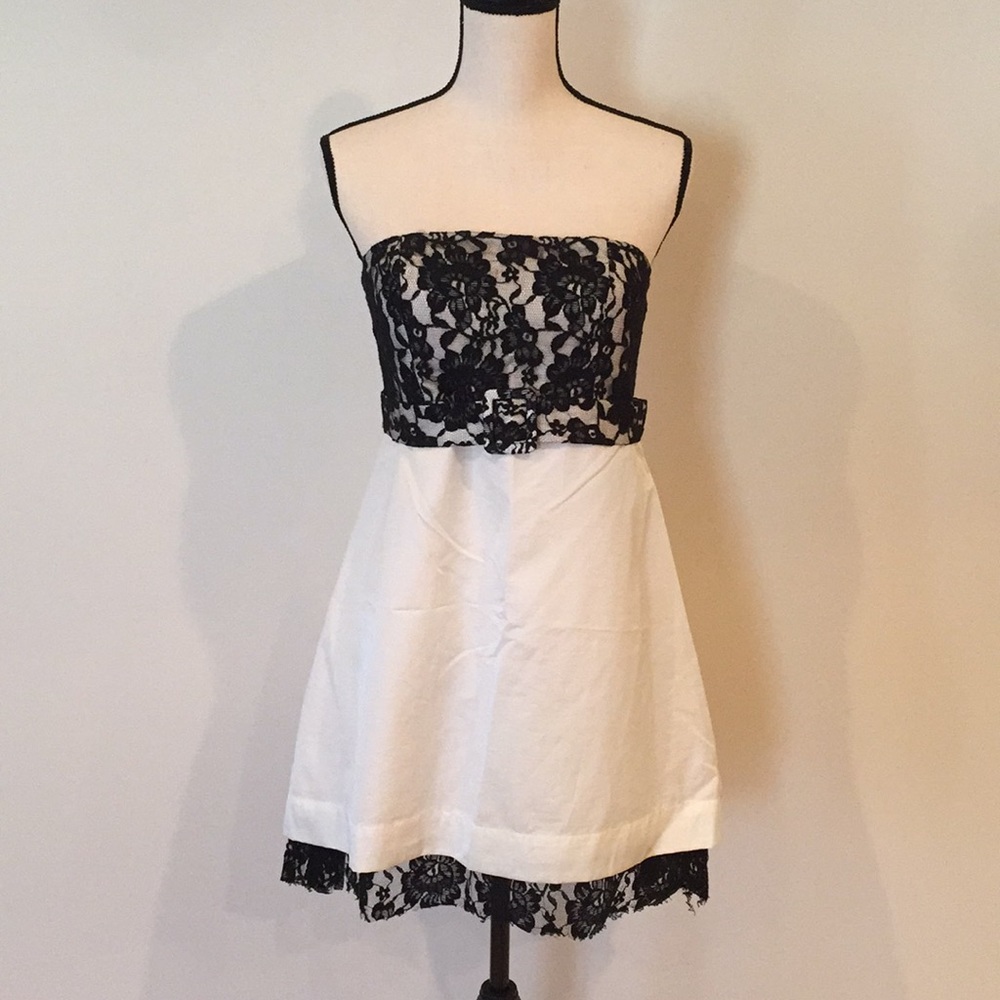 Black and white lace bodice belted strapless dress